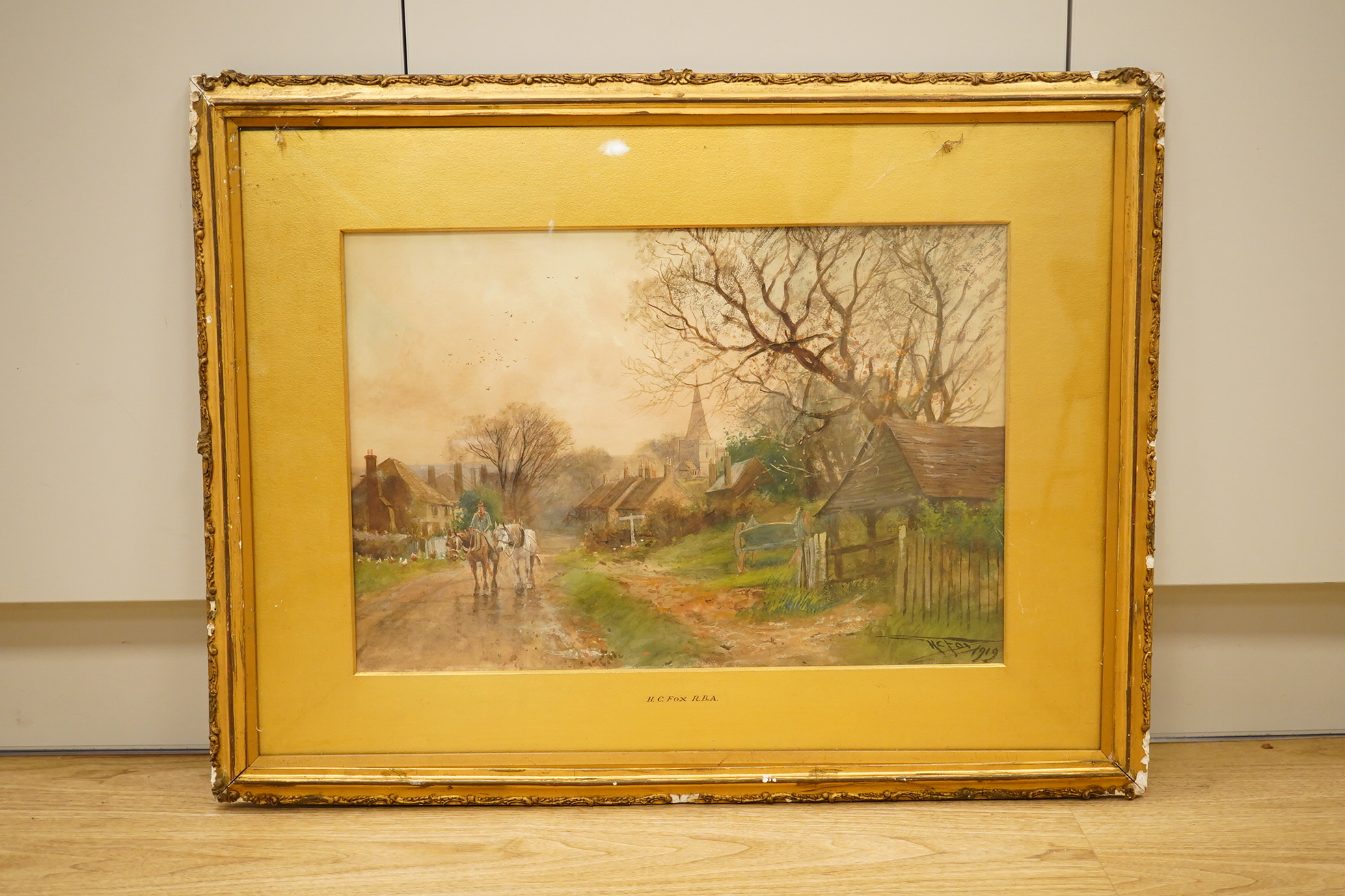 Henry Charles Fox RBA, (1860-1925), watercolour, Village scene with horse and cart, signed and dated 1919, 34 x 50cm, gilt frame. Condition - fair